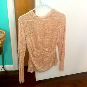 neutral lace top  by guess it has a  lining in it. That’s fit it to cover.